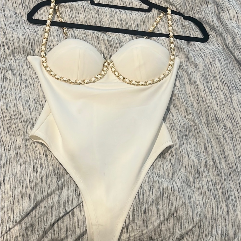 Chic White Bodysuit with Gold Chain Straps